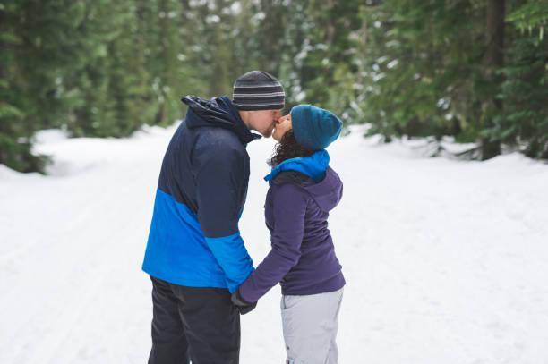 istock Millennial couple snowshoeing in the forest 1168669077
