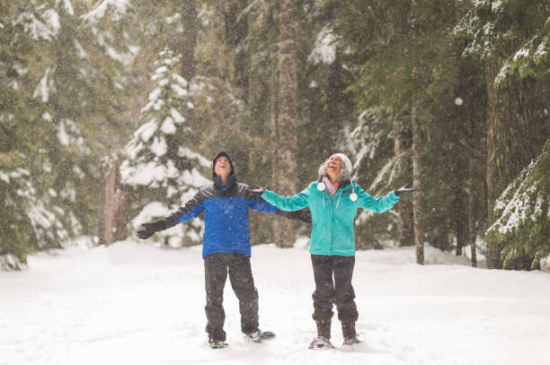 istock A senior couple snowshoeing in the forest 1168669089