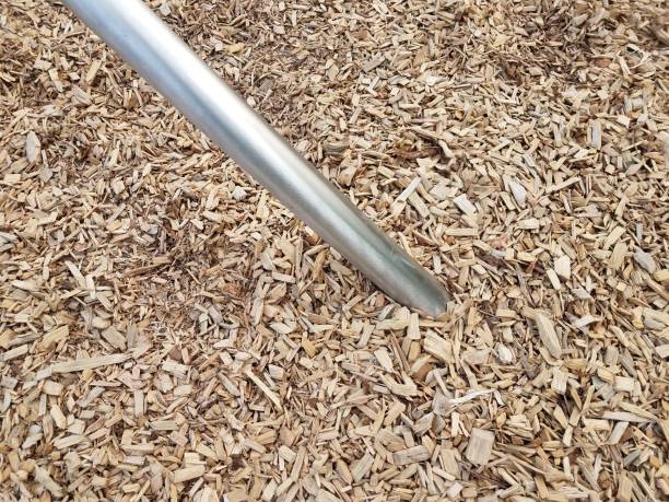 istock silver metal bar or rod in brown mulch 1168671312
