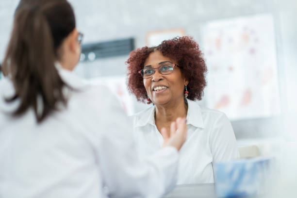 istock Elderly woman enthusiastically discussing with her doctor 1168671390