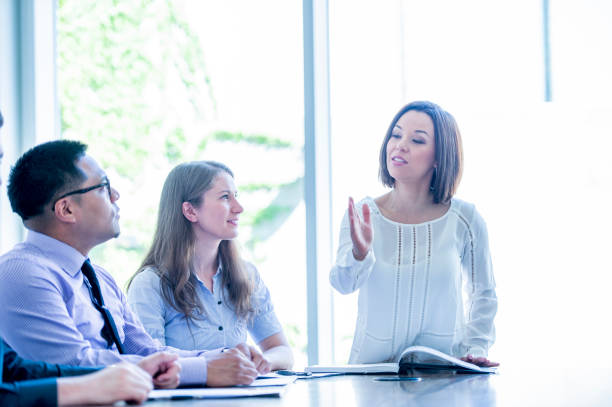 istock Businesswoman instructing others 1168671427