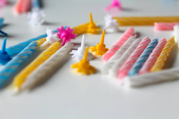 istock Festive background with bright colorful birthday candles on white background 1168671438