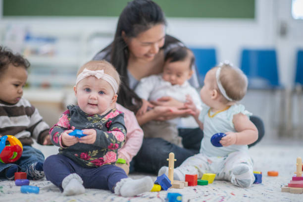 istock Smiling asian woman with babies 1168671622