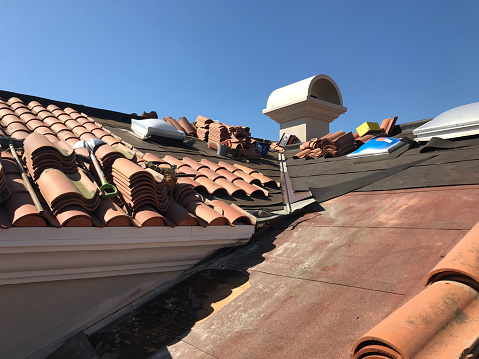 Reroofing a clay tile roof