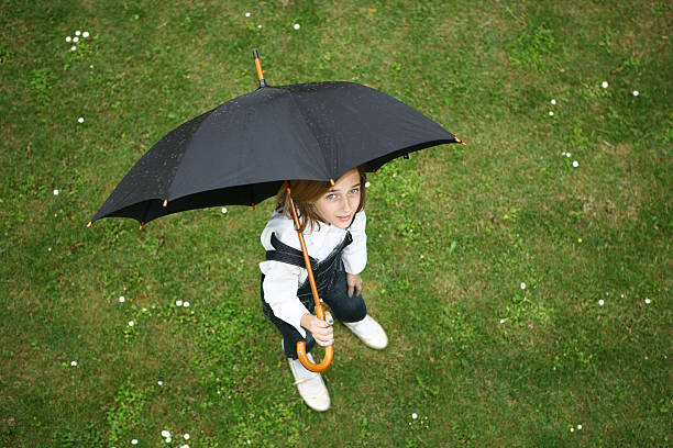 istock Girl with umbrella 116868279