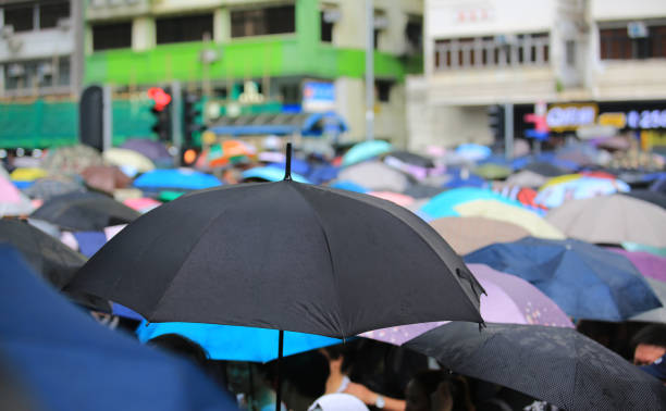 istock open the umbrella when the rain coming 1168685203