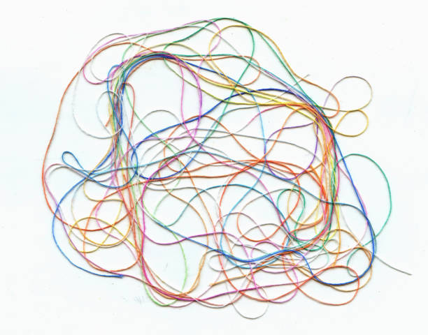 istock Multicolor tangled color needlecraft silk cord. Abstract color background, in white background 1168687063