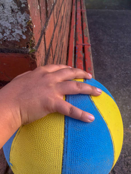 istock Boy's hand on basketball 1168688654