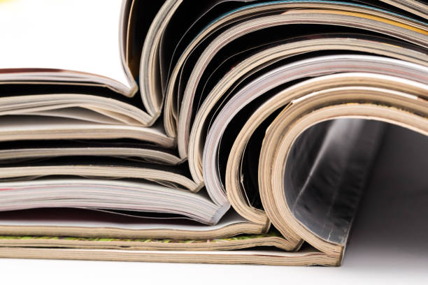 istock selective focus of the stacking magazine place on white background. Colorful abstract background 1168696498
