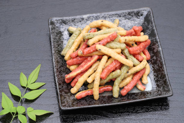 A pot of brightly coloured fish food flakes.