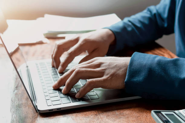 istock businessman hand using laptop working in office. concept finance and accounting 1168701198