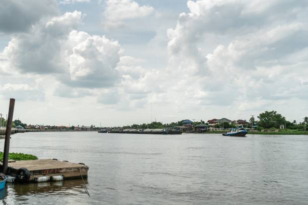 istock small blue boat on the river with sky and cloud. 1168710448
