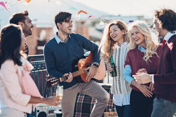 istock Man playing guitar for his friends 1168712296