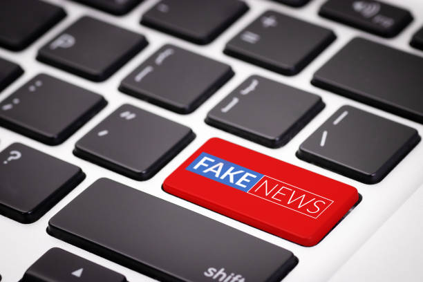red fake news button on laptop keyboard. fake news on internet in modern digital age concept red fake news button on laptop keyboard. fake news on internet in modern digital age concept falsehood stock pictures, royalty-free photos & images