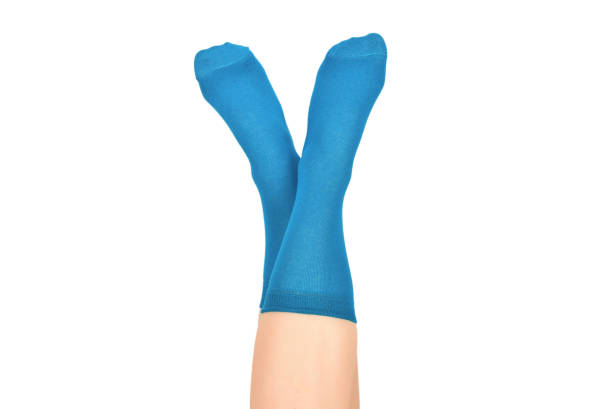 istock Woman in blue socks isolated on white background. Top view. 1168714624