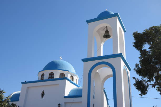 Greek orthodox church standing tall under the clear blue summer sky