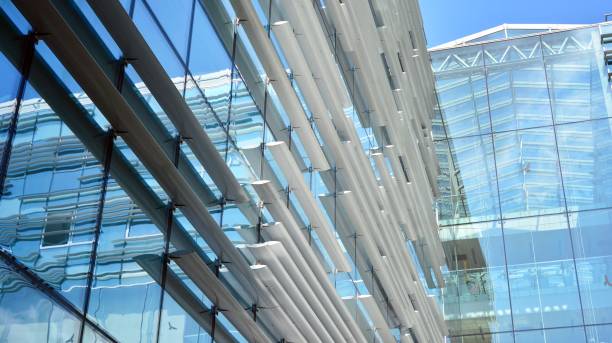 istock Modern office building with reflection in windows of building 1168718027