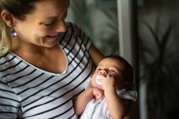 istock Mother holding newborn baby 1168718039
