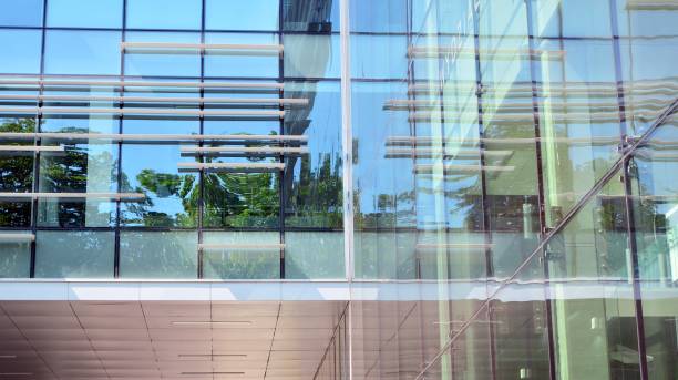 istock Modern office building with reflection in windows of building 1168718065