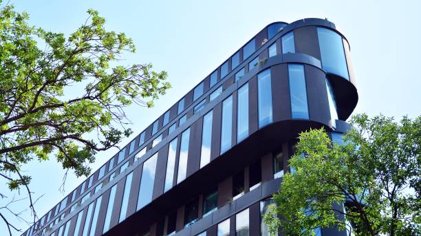 istock Modern office building with reflection in windows of building 1168718123