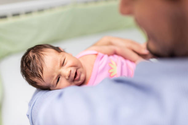 istock Father holding newborn baby 1168718160