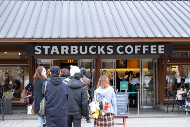 Starbucks Coffee Ueno Onshi Park during pink cherry blossom or Sakura spring season in Tokyo, Japan. stock photo