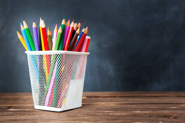 istock Back to school concept with school supplies on blackboard background with copy space 1168722086