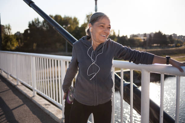 istock Senior woman stretching legs 1168722318