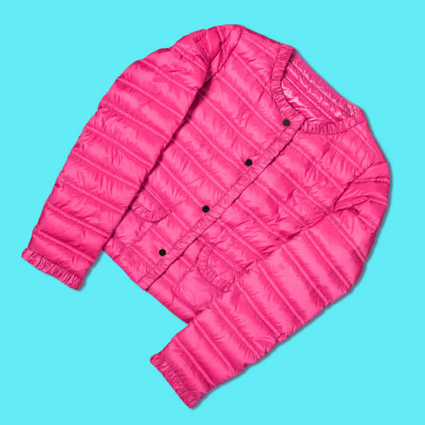 istock Women's pink autumn jacket on a turquoise background, concept 1168722426