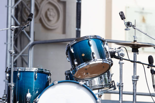 istock Modern drum set on open scene prepared for playing. Sunny day 1168723808