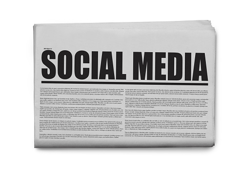 Social media written headlined newspaper isolated on a white background.