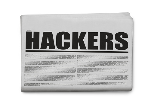 Hackers written headlined newspaper isolated on a white background.
