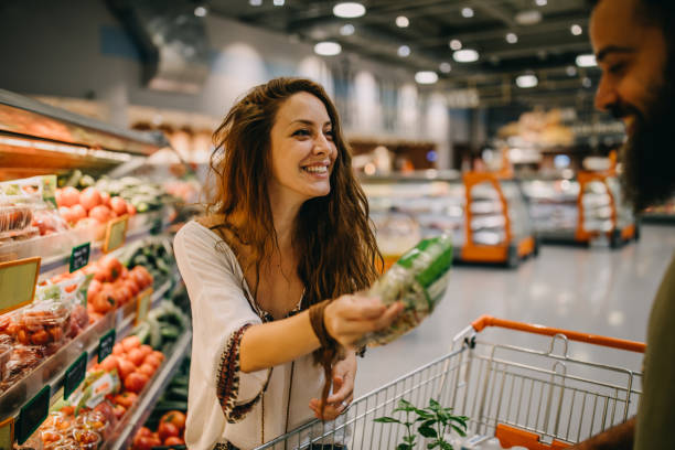 istock Young couple shopping for groceries 1168725311