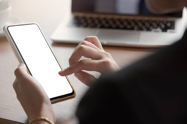 woman using Smartphone. Blank screen mobile phone for graphic display montage.networking service.