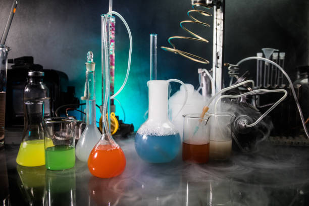 istock Pharmacy and chemistry theme. Test glass flask with solution in research laboratory. Science and medical background. Laboratory test tubes on dark toned background 1168728038