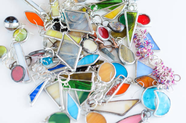 istock Assorted earrings in various colors of glass and metal. Selective focus. Bijouterie texture background. 1168730105
