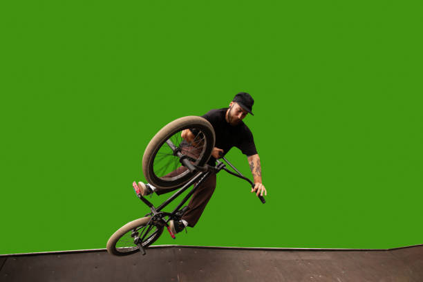 bmx rider on green screen. - bmx cycling bicycle street jumping imagens e fotografias de stock