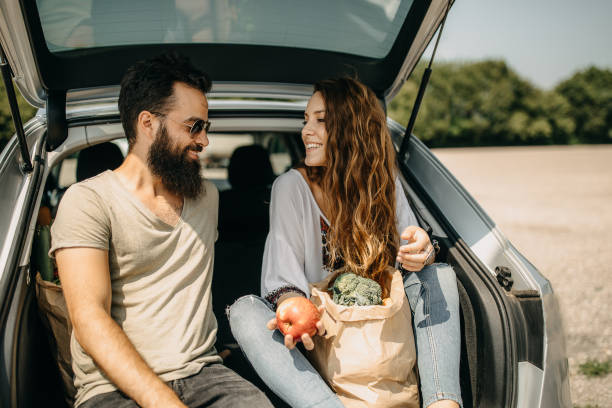 istock Young couple packing groceries 1168731478