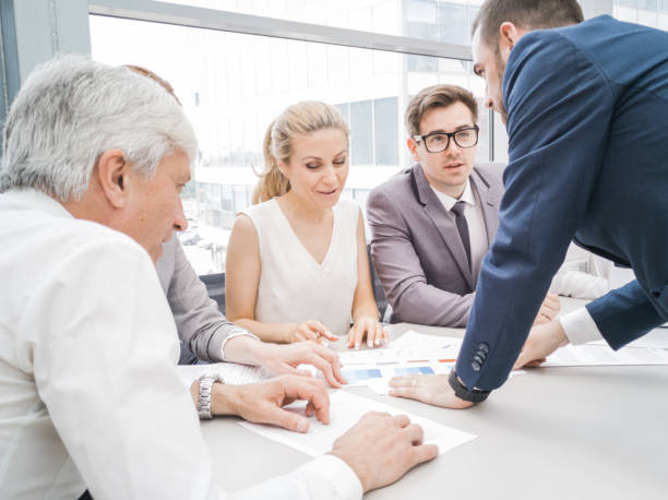 istock Business people discussing diagrams 1168731708