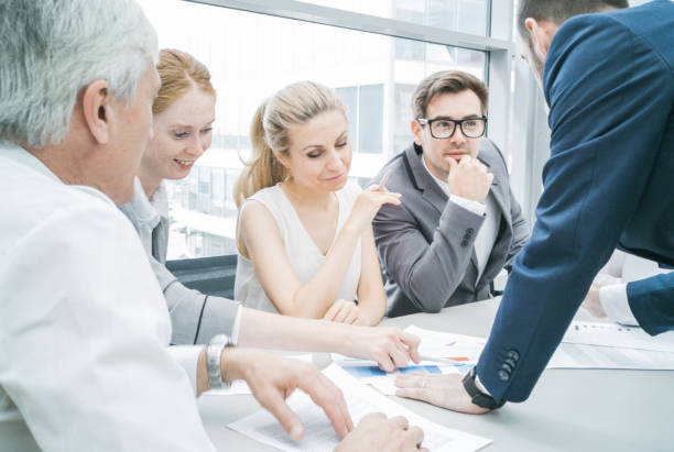 istock Business people discussing diagrams 1168731794