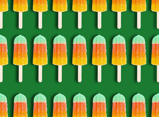 Ice cream fruit wood stick pattern on green background