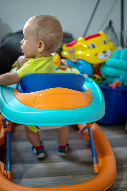 istock First steps of the boy in a baby walker 1168733117