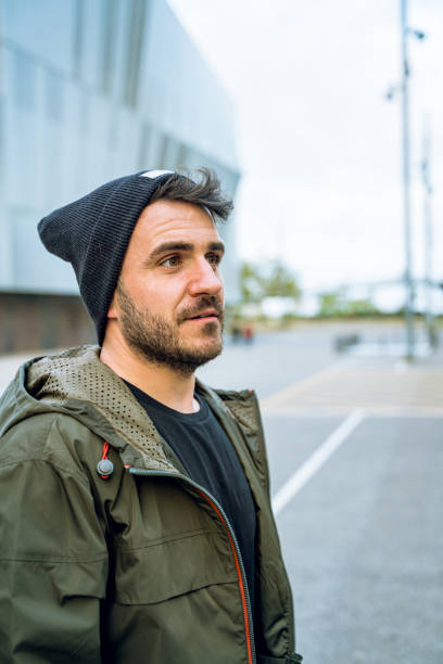 istock Friendly man with a wool hat at the street 1168736027