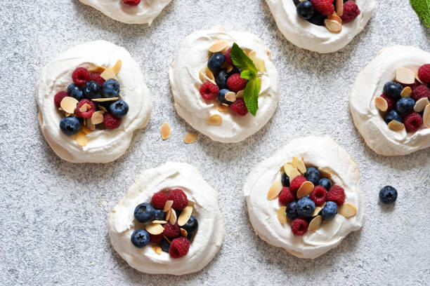 istock Classic dessert Pavlova with cream and berries. View from above. 1168743228