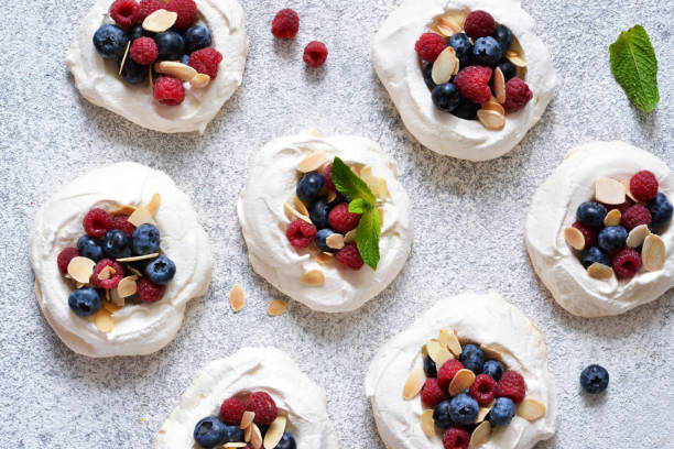 istock Classic dessert Pavlova with cream and berries. View from above. 1168743229