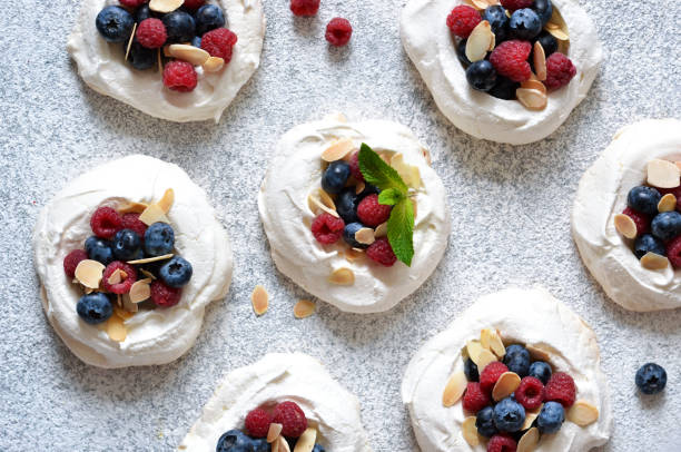 istock Classic dessert Pavlova with cream and berries. View from above. 1168743261