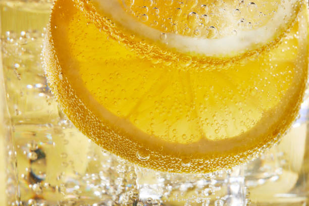 istock Close up of water with lemon slices and bubbles 1168744453