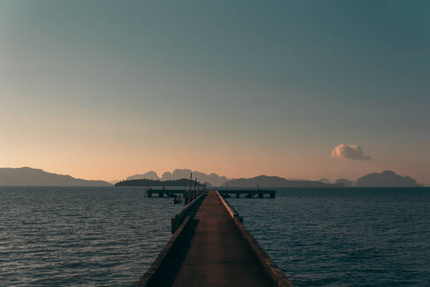 istock Wooden pier on a sea. Idyllic sunset 1168744786