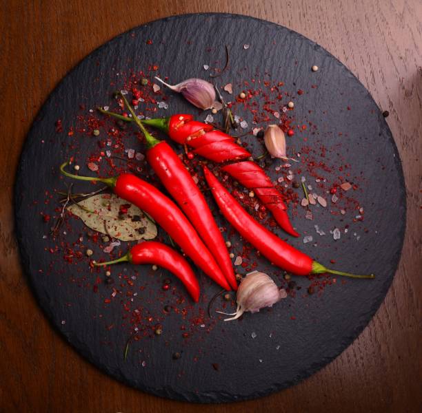 istock Fresh Chili pepper on dark background. View from above 1168745714
