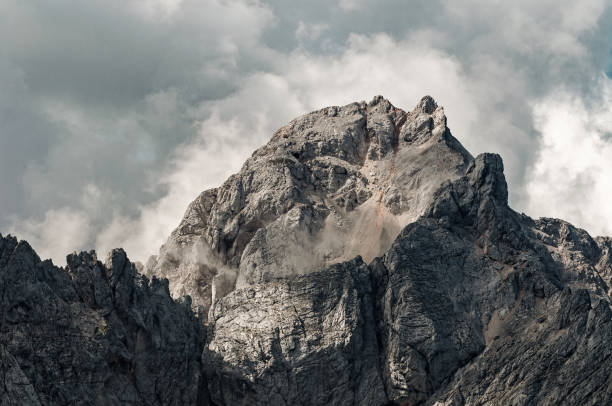 istock Mighty mountain in Slovenian Alps surrounded by dramatic clouds 1168745761